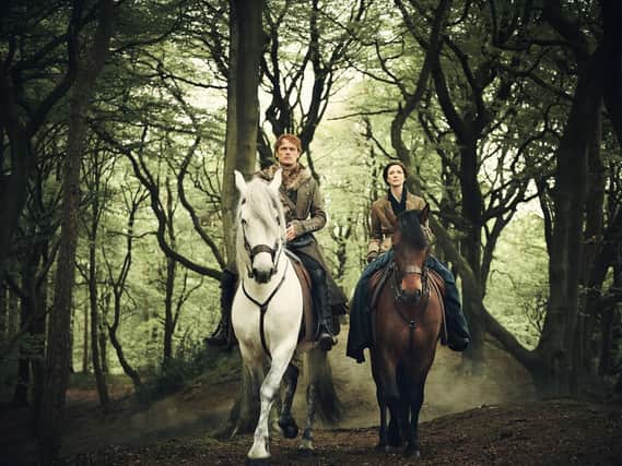 The success of Outlander, starring Sam Heughan and Catriona Balfe, has been a boon to Scottish tourism with the show attracting legions of fans to the Highlands and beyond. PIC: Sony Television/Starz.