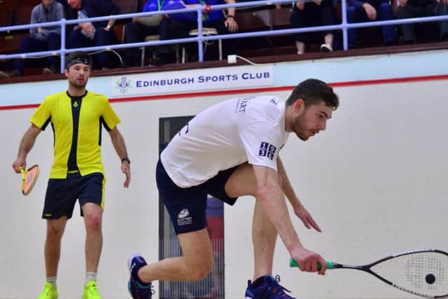 Edinburgh Sports Club's Rory Stewart (white) in action against Newlands' Mike Harris (yellow).