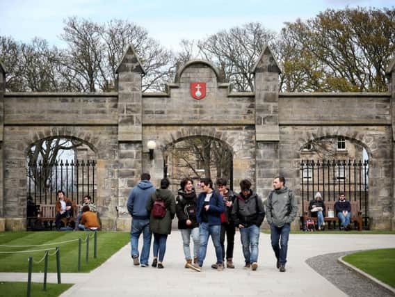 Students gather outside the entrance to the Lower and Upper College Halls at the University of St Andrews