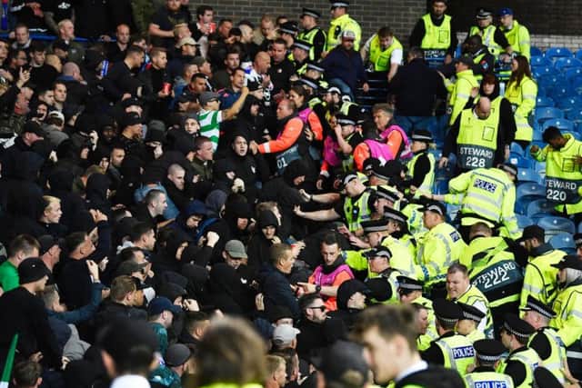 Feyenoord fans clash with police officers at Ibrox