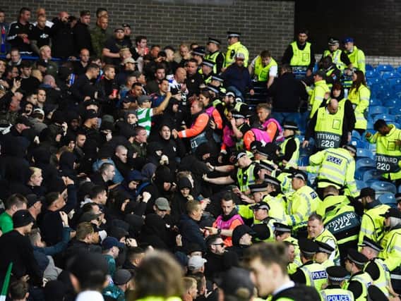 Feyenoord fans clash with police officers at Ibrox