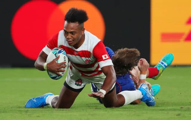 Japan's Kotaro Matsushima scores his team's fourth try in their victory against Russia. Picture: Mike Hewitt/Getty Images