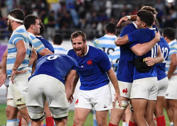 France's fly-half Camille Lopez (C) celebrates with teammate after winning . Pic: Franck Fife/AFP/Getty