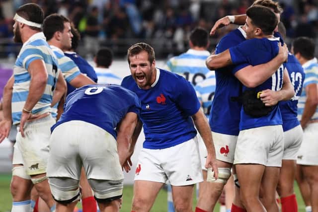 France's fly-half Camille Lopez (C) celebrates with teammate after winning . Pic: Franck Fife/AFP/Getty
