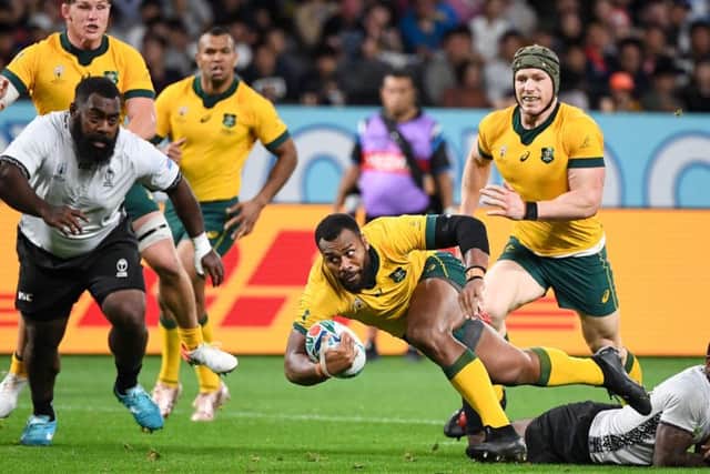 Australia's centre Samu Kerevi (C) is tackled. Pic: William West/ AFP/Getty Images