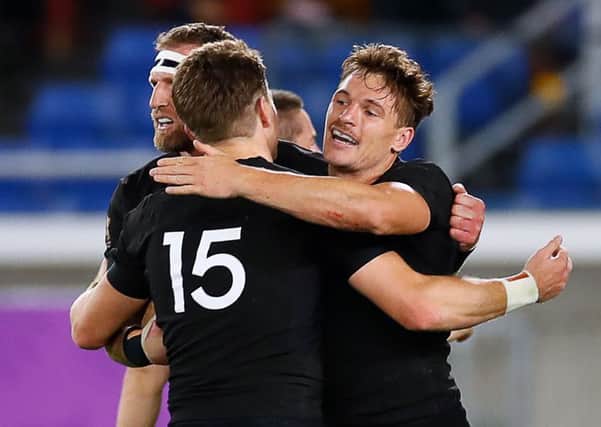 New Zealand's players celebrate a try against South Africa. Pic: Odd Andersen/AFP/Getty