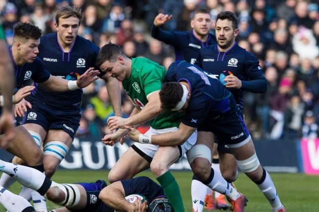 Scotland's Ryan Wilson tackles Ireland's Johnny Sexton during the Six Nations.
