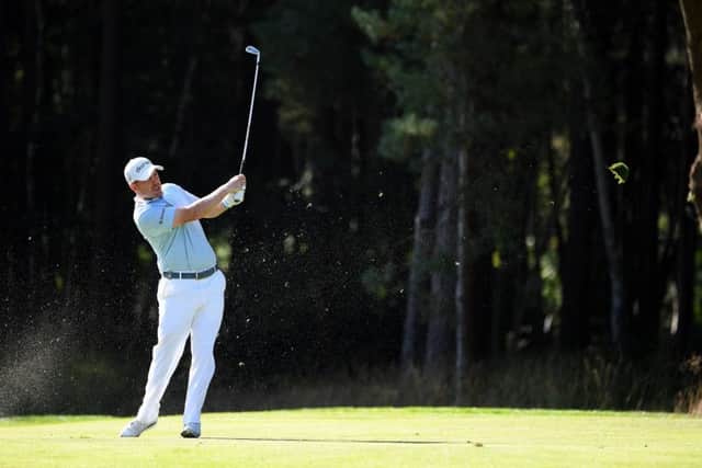 Richie Ramsay plays his second shot on the 13th hole at Wentworth. Picture: Ross Kinnaird/Getty Images