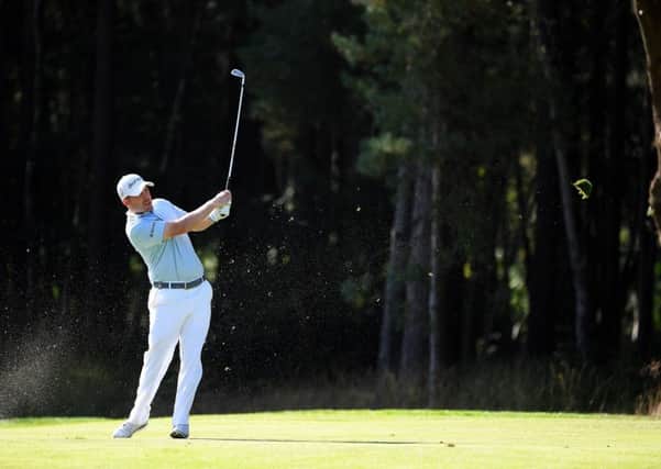 Richie Ramsay plays his second shot on the 13th hole at Wentworth. Picture: Ross Kinnaird/Getty Images