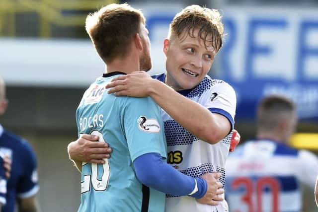Peter Grant, right, celebrates his winning goal with team-mate Danny Rogers. Picture: SNS