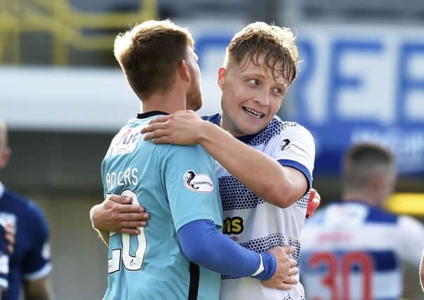 Peter Grant, right, celebrates his winning goal with team-mate Danny Rogers. Picture: SNS