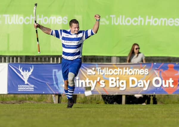 Newtonmore's Glen MacKintosh celebrates one of his two goals in the Camanachd Cup final win over Oban Camanachd. Picture: Neil G Paterson