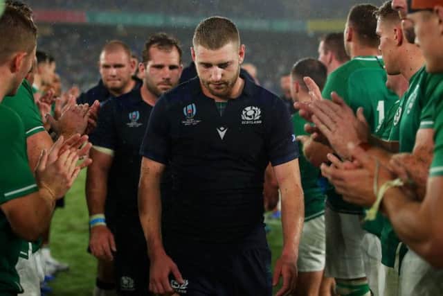 A dejected Finn Russell trudges off the pitch in Yokohama after a difficult World Cup opener