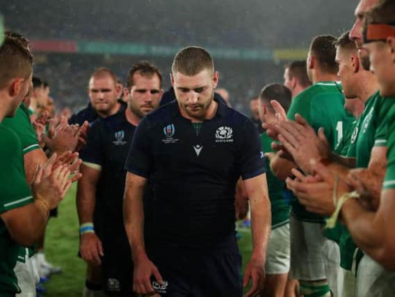 A dejected Finn Russell trudges off the pitch in Yokohama after a difficult World Cup opener