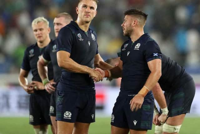Chris Harris and Ali Price look dejected at the end of the Pool A clash in Yokohama