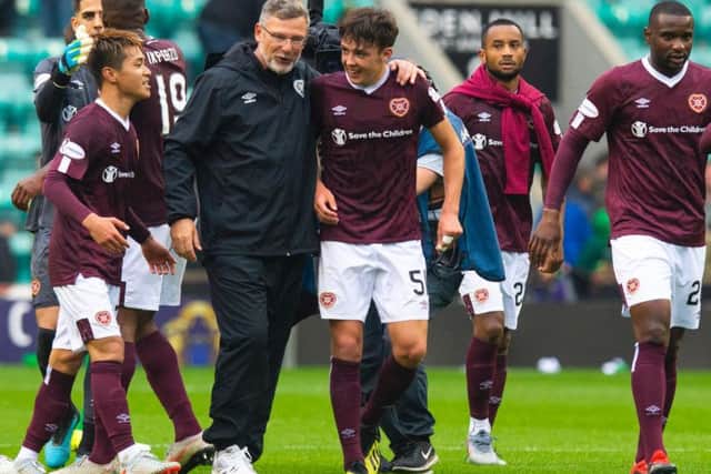 Manager Craig Levein celebrates with the Hearts players at full-time.