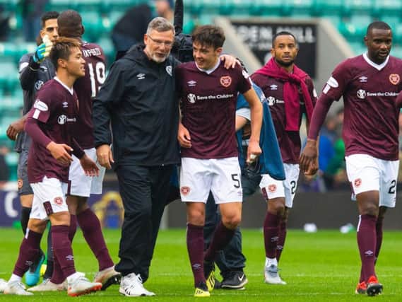 Manager Craig Levein celebrates with the Hearts players at full-time.