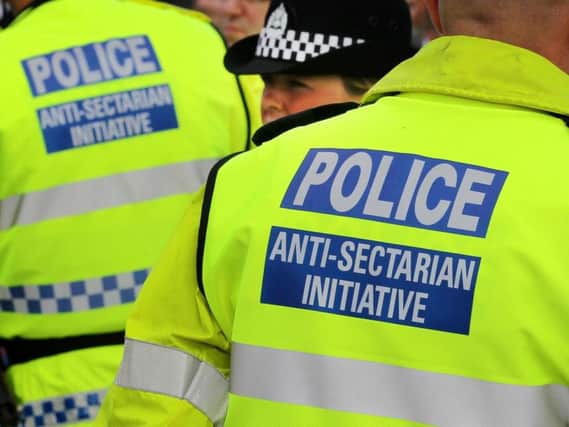 Police wearing Anti-Sectarian Initiative jackets at the Old Firm match between Glasgow Rangers and Glasgow Celtic at Ibrox, Glagow. Picture: PA