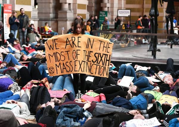 Extinction Rebellion campaigners stage a 'die-in' at the Kelvingrove Art Gallery and Museum in Glasgow. Picture: John Devlin