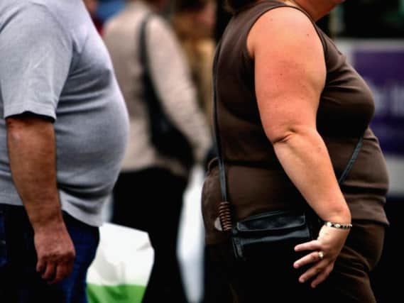 An overweight person walks through Glasgow city centre. Picture: Getty Images