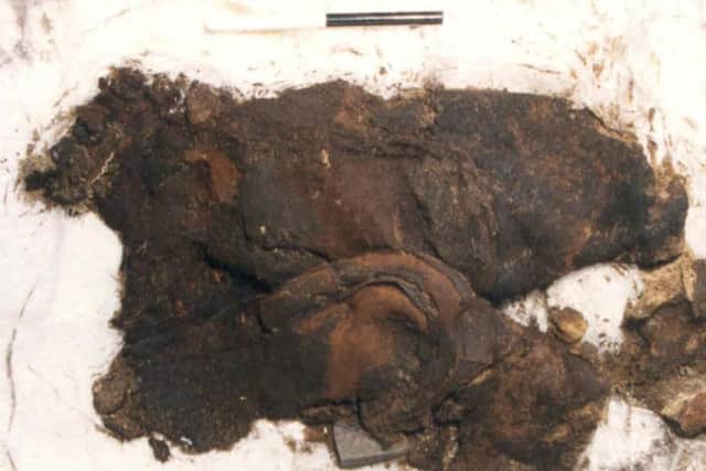 The 600-year-old boots were found complete with copper buckle. They are the only known pair of their kind to be found in Scotland. PIC: FAS Heritage.
