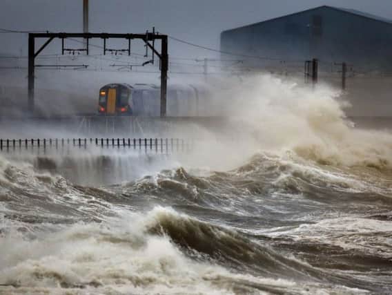 The Climate Change Adaptation Programme sets out 170 policies and actions to be taken by Holyrood to mitigate the harm caused by storms, flooding and coastal erosion. Picture: PA