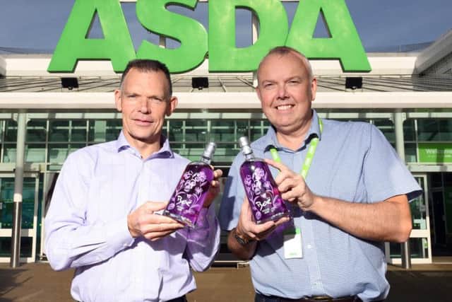 Graham Coull, director of Boe Gin, left, with Dougie Burton of Asda's Cumbernauld store. Picture: Paul Chappells