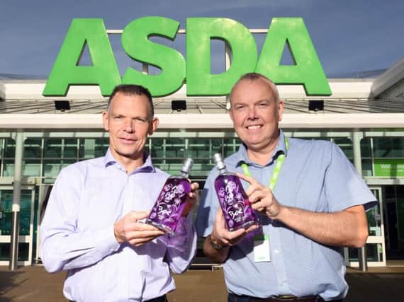 Graham Coull, director of Boe Gin, left, with Dougie Burton of Asda's Cumbernauld store. Picture: Paul Chappells
