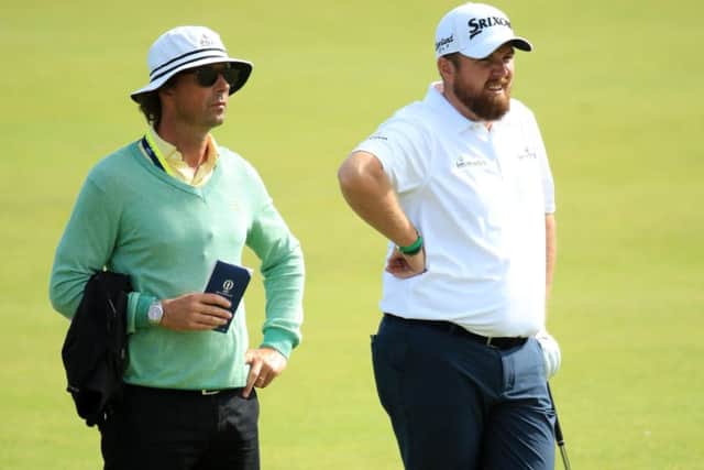 Shane Lowry, right, and coach Neil Manchip during a practice round before the 2019 Open Championship at Royal Portrush. Picture: Andrew Redington/Getty