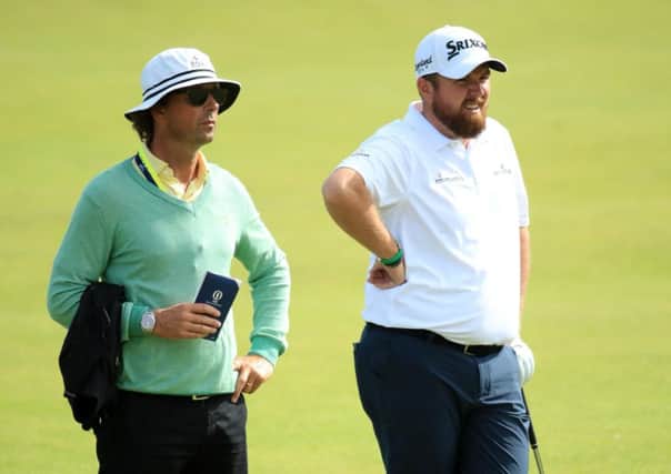 Shane Lowry, right, and coach Neil Manchip during a practice round before the 2019 Open Championship at Royal Portrush. Picture: Andrew Redington/Getty