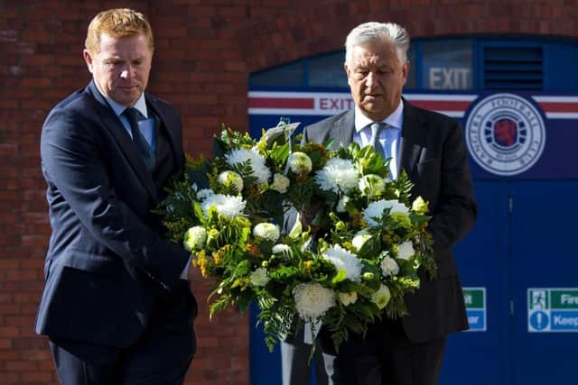 Celtic manager Neil Lennon and chief executive Peter Lawwell pay tribute to Fernando Ricksen at Ibrox. Picture: Ross MacDonald/SNS