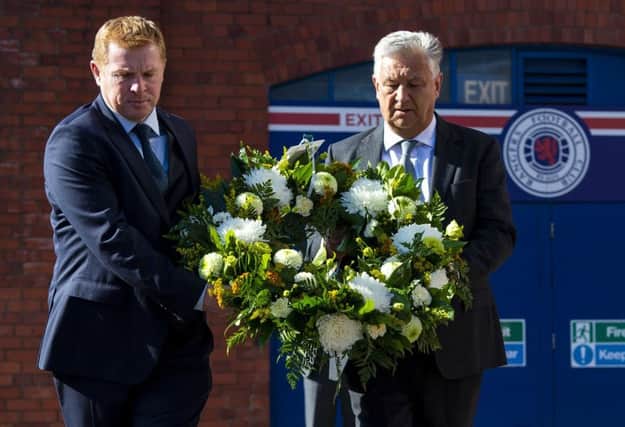 Celtic manager Neil Lennon and chief executive Peter Lawwell pay tribute to Fernando Ricksen at Ibrox. Picture: Ross MacDonald/SNS