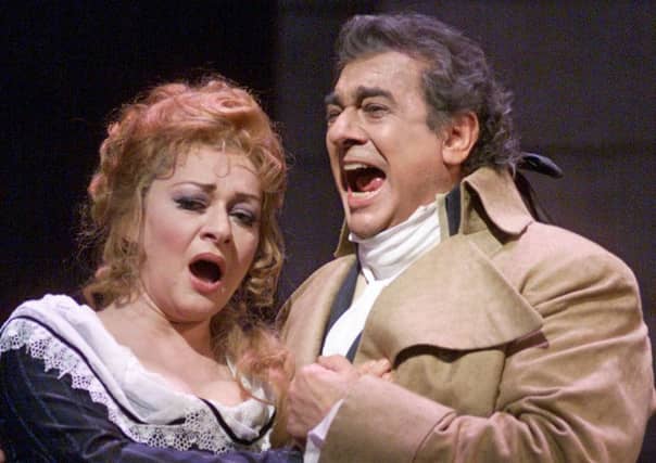 Tenor Placido Domingo, right, and soprano Daniela Dessi performing Umberto Giordano's Andrea Chenier during a rehearsal for the Metropolitan Opera's Millennium Gala at New York's Lincoln Center. Picture: AP Photo/Richard Drew
