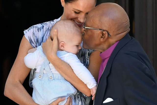 Meghan, Archie and peace laureate Archbishop Desmond Tutu. Picture: PA