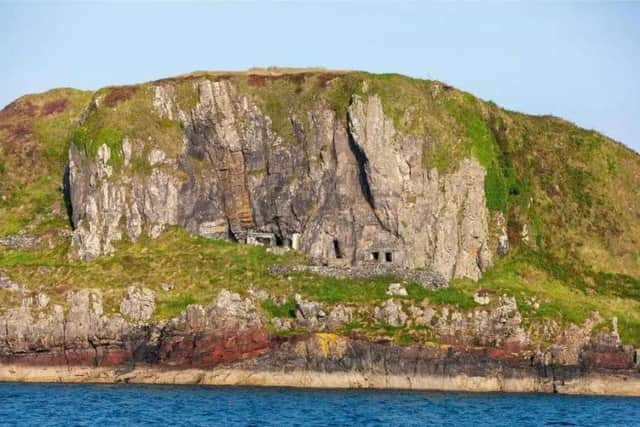 The island has rough grass bordered by rocky outcrops and cliff faces. There is also a natural cave and the ruins of two croft cottages.