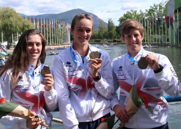 Kimberley Woods, Mallory Franklin and Fiona Pennie celebrate their gold medals. Picture: British Canoeing