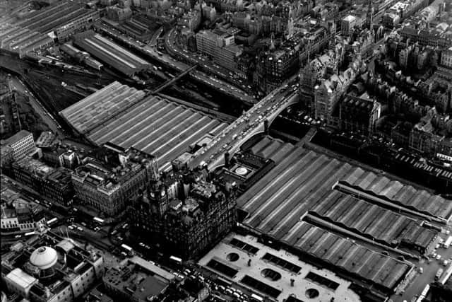 A 1970s aerial view showing how the present North Bridge connects the Old and New Towns of Edinburgh. Picture: TSPL