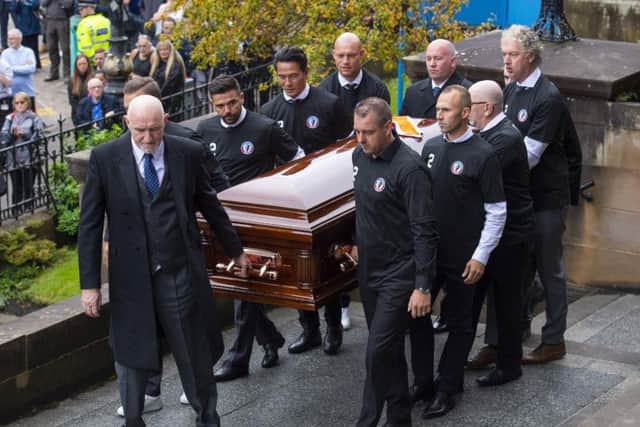 Fernando Ricksen's coffin is carried into the church