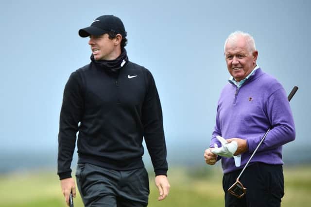 Rory McIlroy and his father, Gerry, practise at the Old Course. Picture: Mark Runnacles/Getty Images