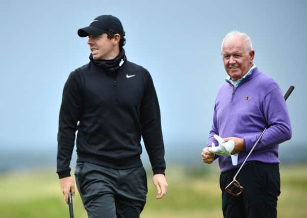 Rory McIlroy and his father, Gerry, practise at the Old Course. Picture: Mark Runnacles/Getty Images