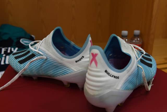 A close-up of Tierney's boots, with "Bhoys" on the left shoe