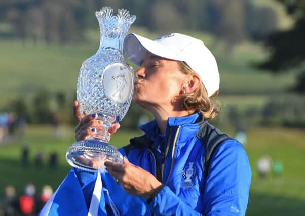 Europe's team captain Catriona Matthew celebrates with the trophy after the singles on the third day of The Solheim Cup golf tournament at Gleneagles in Scotland. Picture: Andy Buchanan/Getty Images