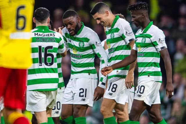Olivier Ntcham celebrates with Lewis Morgan and fellow goalscorers Tom Rogic and Vakoun Issouf Bayo