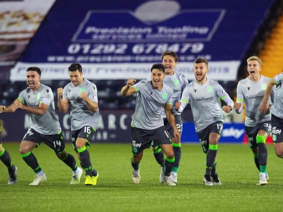 The Hibs players celebrate after winning the penalty shoot-out