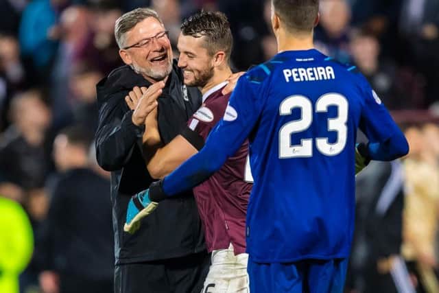 Hearts manager Craig Levein celebrates with Craig Halkett and Joel Pereira. Picture: Roddy Scott/SNS