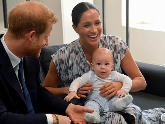 Prince Harry, Meghan Markle and their son Archie in Africa, meeting Archbishop Desmond Tutu. Picture: PA