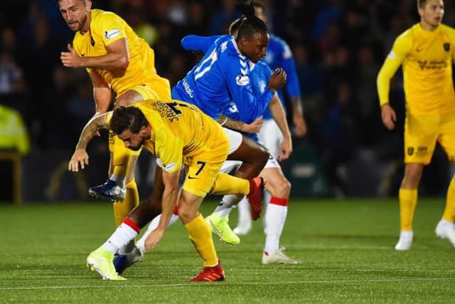 Rickie Lamie clashes with Joe Aribo. Picture: SNS