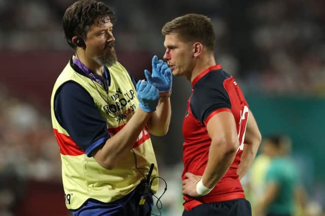Owen Farrell receives attention following the tackle that led to USAs John Quill being dismissed.  Picture: Getty