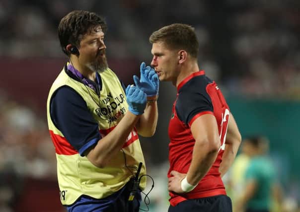 Owen Farrell receives attention following the tackle that led to USAs John Quill being dismissed.  Picture: Getty