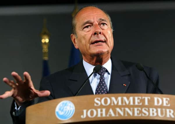 Former French president Jacques Chirac gestures as he delivers a speech at The French Pavilon in Johannesburg in 2002. Picture: Patrick Kovarik/Getty Images